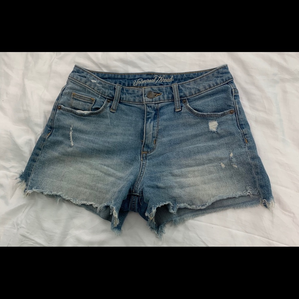Light blue distressed high rise short shorts.